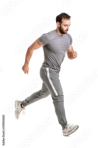 Sporty male runner on white...