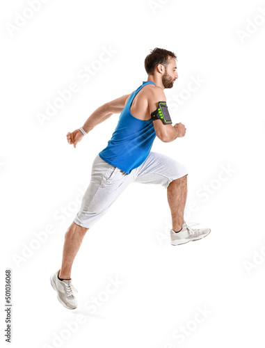 Sporty male runner on white background