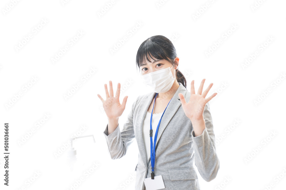Young business person using alcohol disinfectant Young business person using alcohol disinfectant