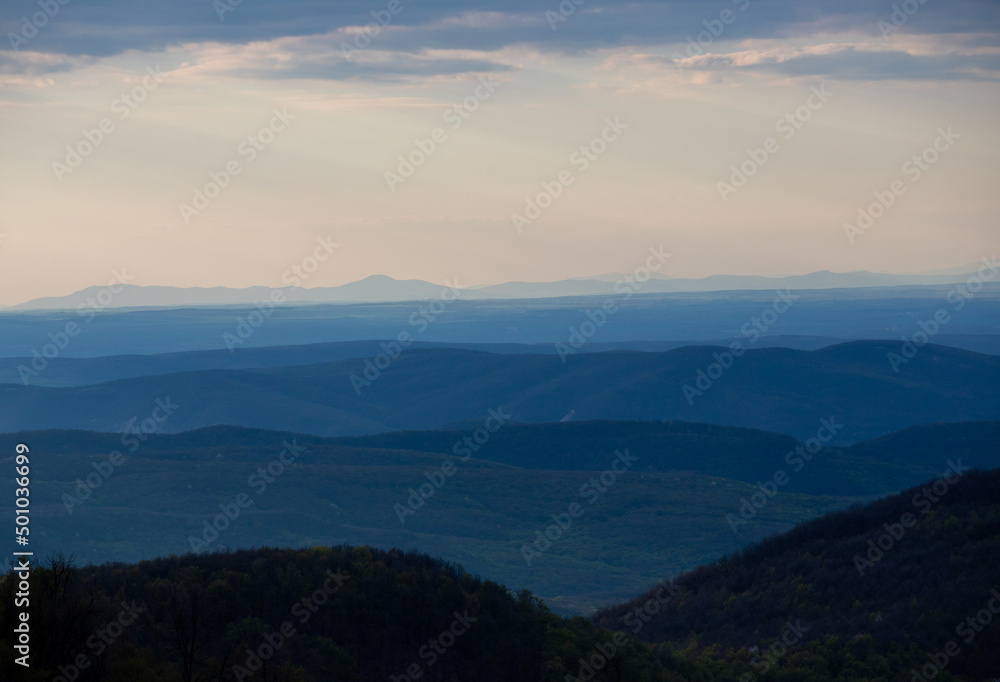 the peaks of the hills in the morning. Hills silhouette landscape background