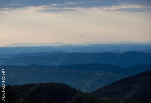 the peaks of the hills in the morning. Hills silhouette landscape background © sebi_2569