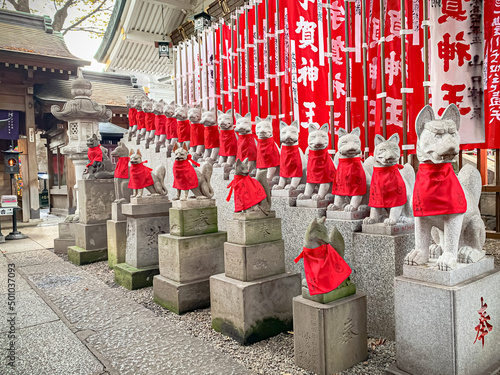Fox statues at Toyokawa Inari Betsuin in Tokyo, Japan photo