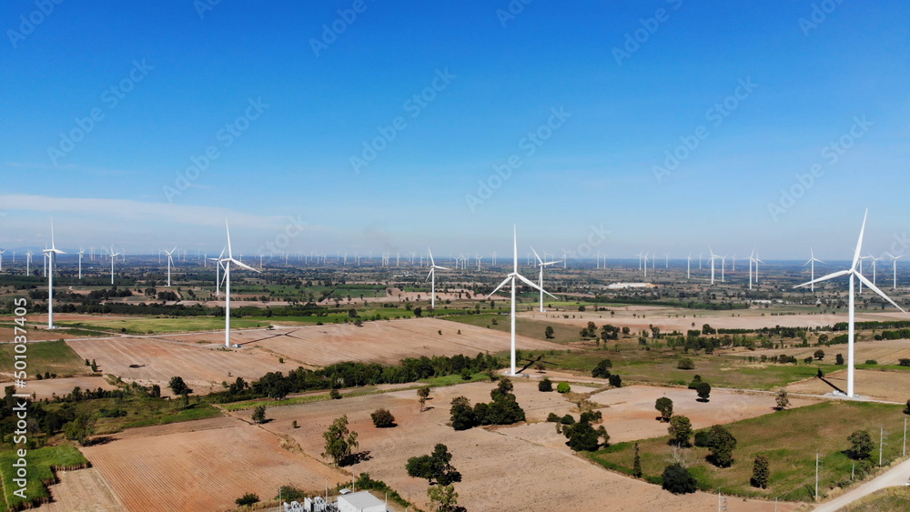 Large wind turbines with blades in the windmills farm