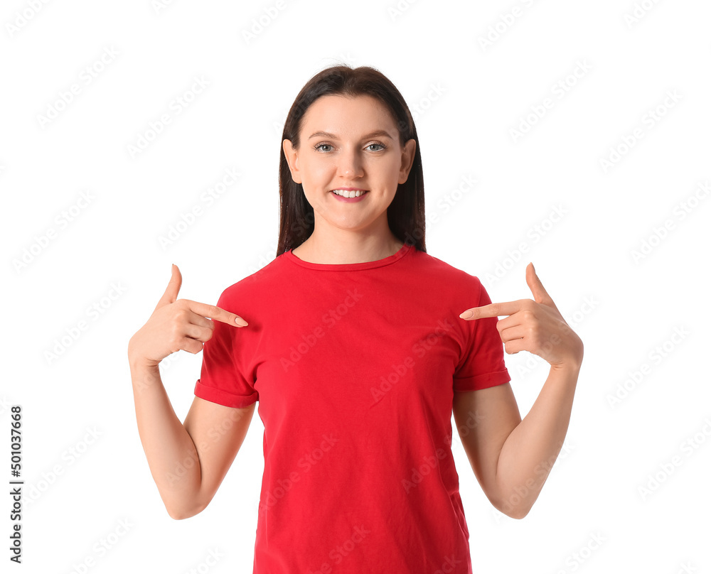 Young woman pointing at red t-shirt on white background Young woman pointing at red t-shirt on white background
