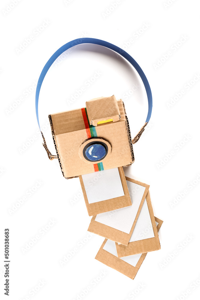 Cardboard photo camera with pictures on white background