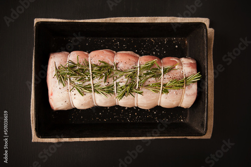 Uncooked pork roast with rosemary  photo