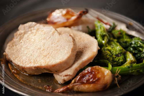 Roast pork with garlic and broccoli rabe photo