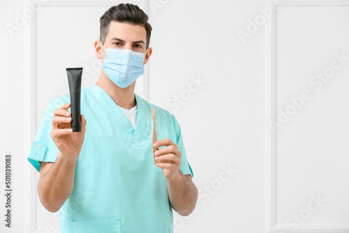 Male dentist with activated...