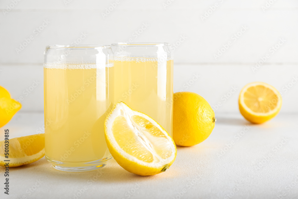 Glasses of lemon juice on table Glasses of lemon juice on table