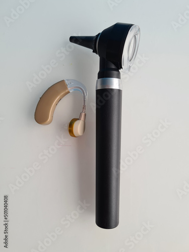 Otoscope and hearing aid and hearing test closeup photo