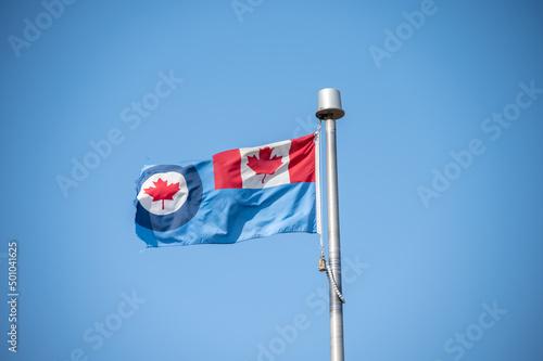 Royal Canadian Air Force (RCAF) flag on blue sky. photo