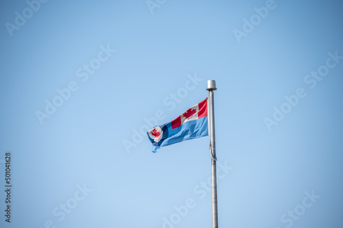 Royal Canadian Air Force (RCAF) flag on blue sky. photo