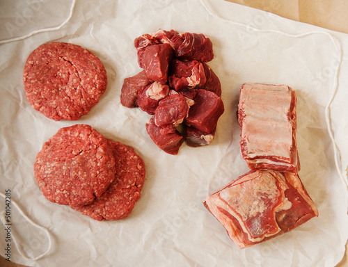 Assorted Raw Beef Cuts on Butcher's Paper; From Above photo