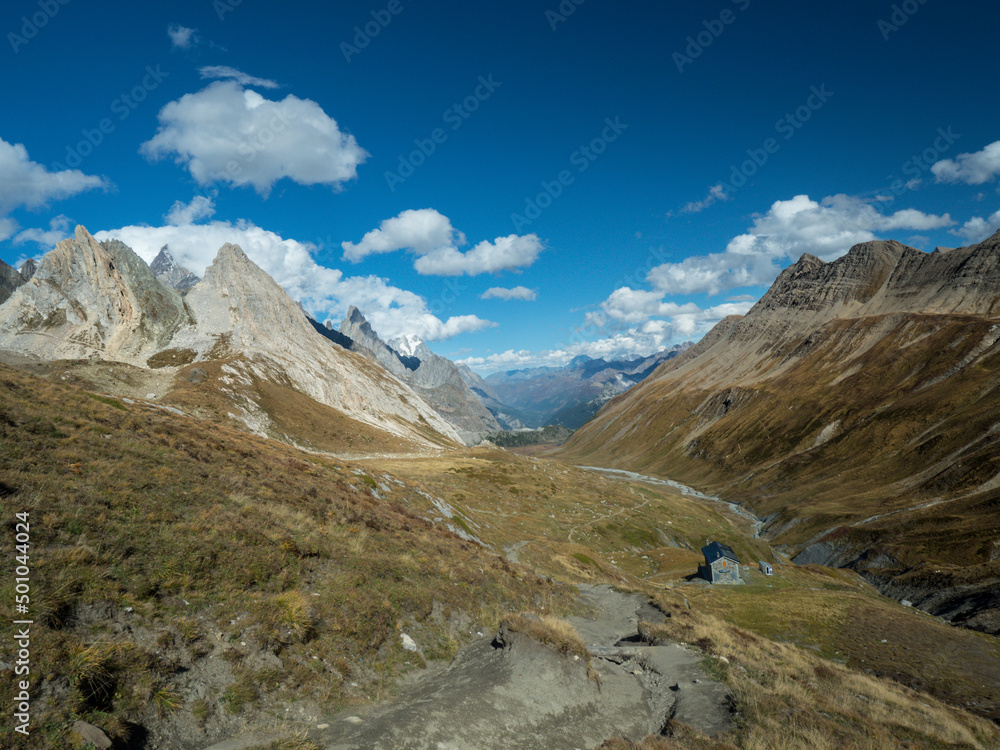 Panoramic view of the mountain border between France and Italy. Frontier house in the mountains. Tour du Mont Blanc