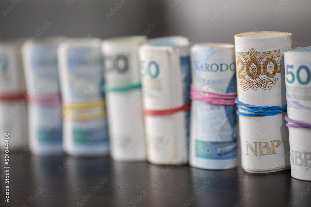 Lined up diagonally, official Polish banknotes rolled up. Lined up diagonally, official Polish banknotes rolled up.
