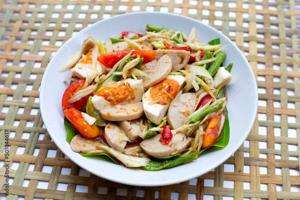 Spicy papaya salad with salted egg and vietnamese pork sausage Spicy papaya salad with salted egg and vietnamese pork sausage