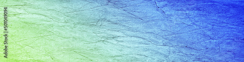 Beautiful blue green texture. Gradient. Toned cracked rough stone surface. Abstract colorful background with space for design. Backdrop, wallpaper. Web banner. Website header. Panoramic.