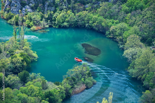 High angle view of boat floating on beautiful green river
