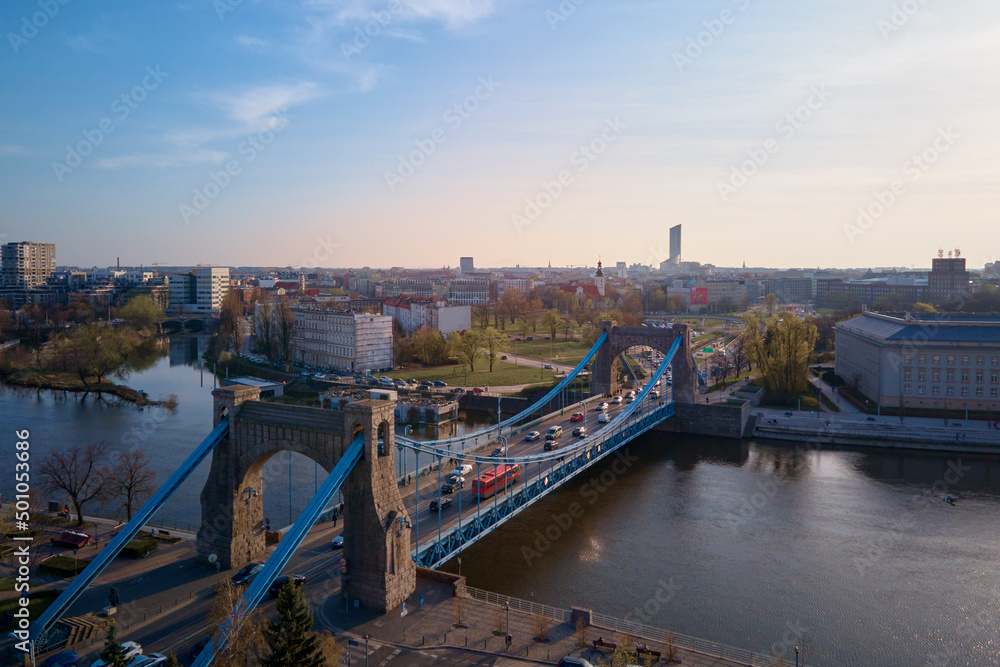 Aerial panorama of Wroclaw city with car bridge over Odra river in Poland, Urban cityscape with historical european architecture
