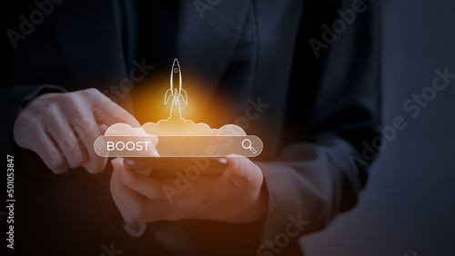 SEO Search Engine Optimization, Rocket is launching and soar flying out from screen with search bar and text BOOST , optimizing your website to rank in search engines or SEO.
