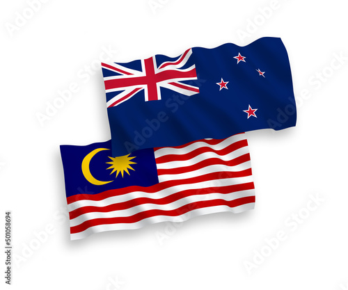 National vector fabric wave flags of New Zealand and Malaysia isolated on white background. 1 to 2 proportion.