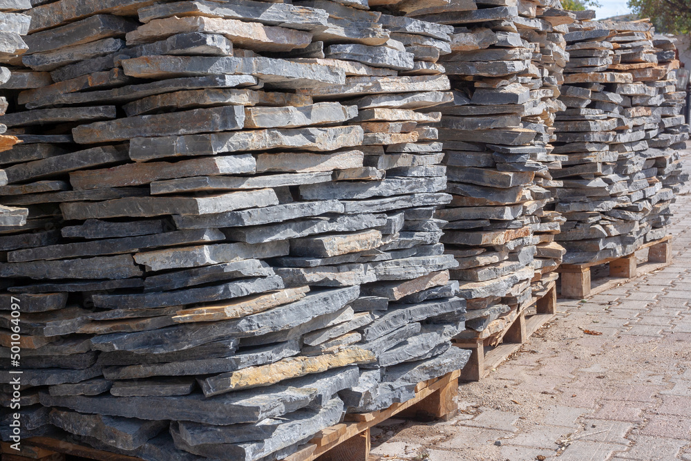 Pallets with natural stone close up. Folded flagstone. Pallets with natural stone close up. Folded flagstone.