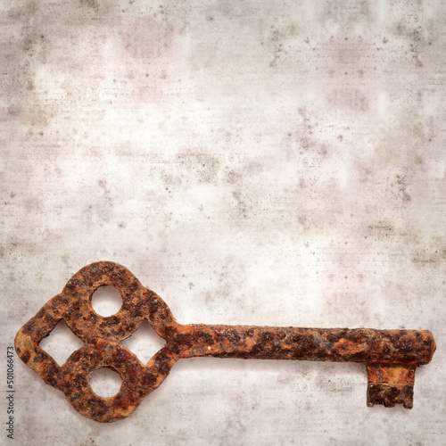 stylish textured old paper background with old rusty key  © Tamara Kulikova