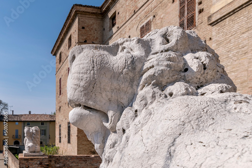 The statue of a white lion in the historic center of Soragna, Parma, Italy photo