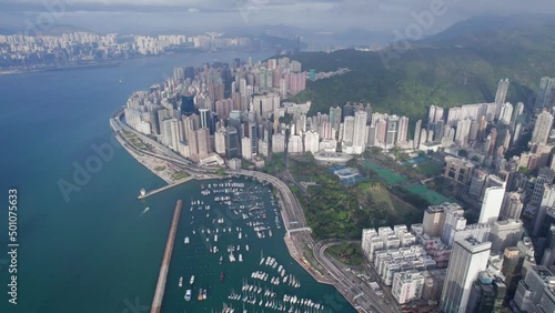 Amazing aerial footage of business towers, traffic highway and yacht in Causeway Bay, Hong Kong photo