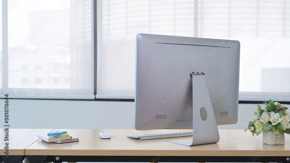 Modern workplace with computer pc, potted plant and sticky notes on wooden table. Modern workplace with computer pc, potted plant and sticky notes on wooden table.