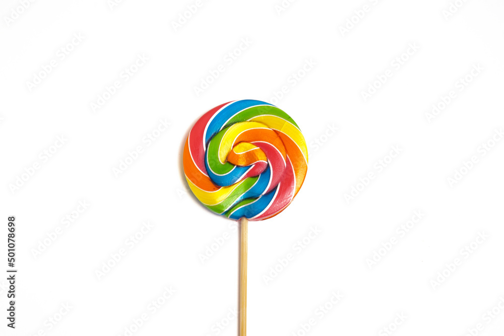 Bright multi-colored round lollipop. Isolated on a white background. Bright multi-colored round lollipop. Isolated on a white background.