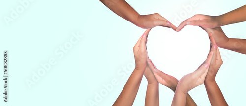 Photography International Human Solidarity Day concept: Unity and diversity are at the heart of a diverse group of people connected together as a supportive symbol that represents a sense of teamwork