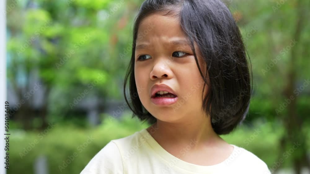 Portrait of Asian angry, sad and cry little girl, The emotion of a child when tantrum and mad, expression grumpy emotion. Kid emotional control concept Portrait of Asian angry, sad and cry little girl, The emotion of a child when tantrum and mad, expression grumpy emotion. Kid emotional control concept