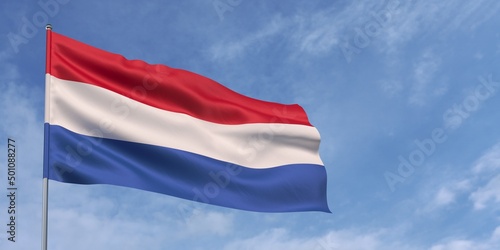 Photos Netherlands flag on flagpole on blue sky background