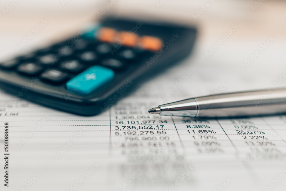Pen and calculator on desk office. Object for calculator to calculate balance, projit, currency and cost. Accounting and Financial concept. Pen and calculator on desk office. Object for calculator to calculate balance, projit, currency and cost. Accounting and Financial concept.