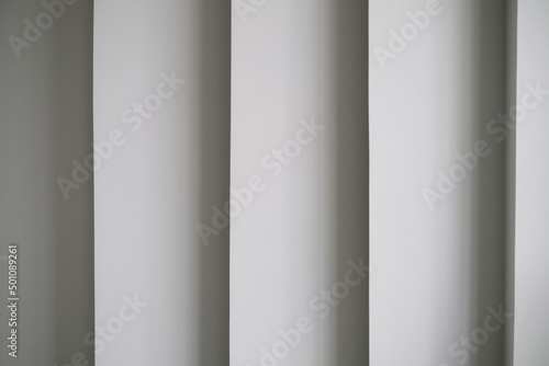 modern architecture detail. Abstract angular building wall, futuristic gray abstract background with shadows.