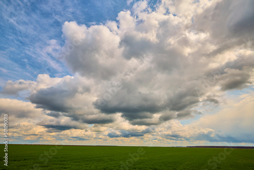 beautiful landscape with an agricultural field on a spring day © czamfir