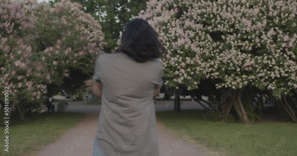 Young enamored friends, hugging and circling in the park in slow motion. Young enamored friends, hugging and circling in the park in slow motion.
