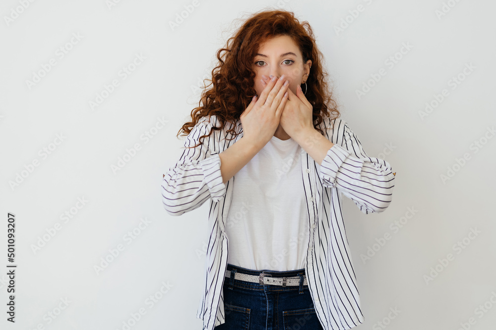 Shocked, speechless and amazed redhead curly woman in yellow sweater losing speech from astonishment and shock, raise arms sideways, gasping and open mouth stare impressed on white background Shocked, speechless and amazed redhead curly woman in yellow sweater losing speech from astonishment and shock, raise arms sideways, gasping and open mouth stare impressed on white background