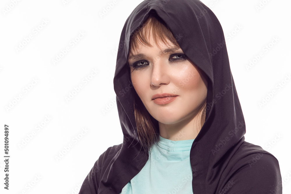Closeup Portrait of Positive Winsome Blond Caucasian Female Athlete In Black Hoody Posing With Folded Hands While Looking Straight Against Pure White. Closeup Portrait of Positive Winsome Blond Caucasian Female Athlete In Black Hoody Posing With Folded Hands While Looking Straight Against Pure White.