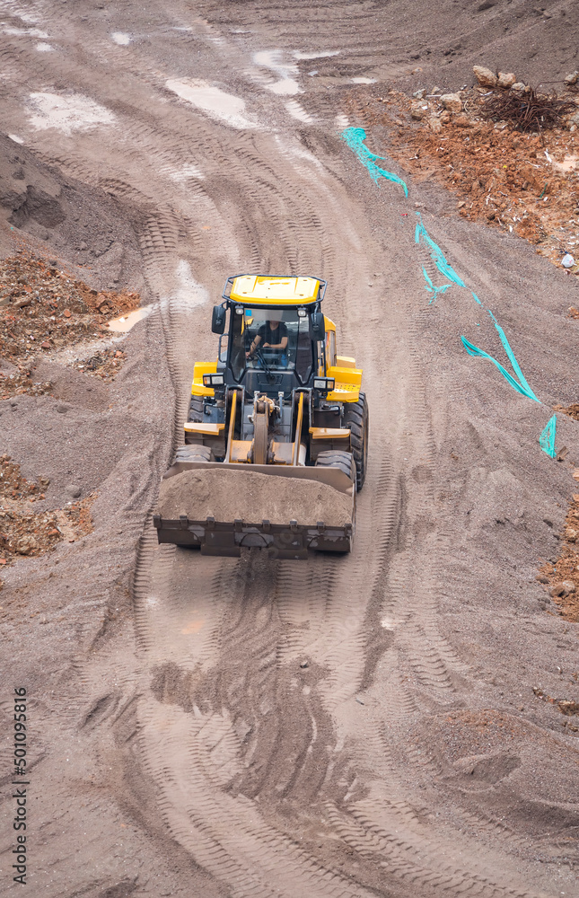excavator loader machine during earthmoving works outdoors excavator loader machine during earthmoving works outdoors