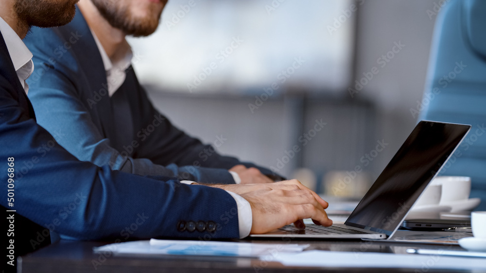 Young businessman person using a computer laptop notebook in technology device in office Young businessman person using a computer laptop notebook in technology device in office