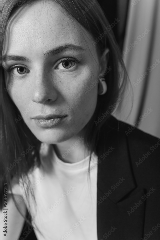 Young beauty business woman in elegant suit indoors. Smart, intelligent woman Young beauty business woman in elegant suit indoors. Smart, intelligent woman