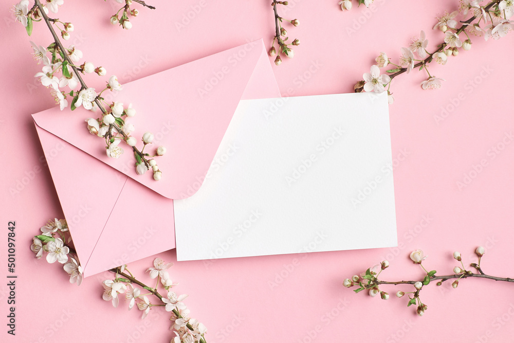 Greeting card mockup with envelope and white flowers on pink background