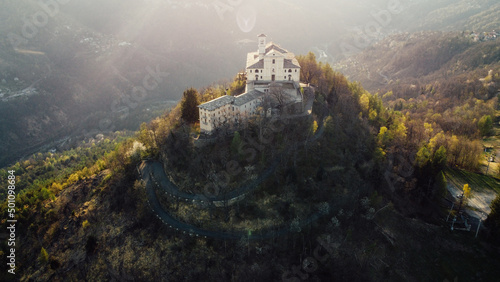 Aerial view of Sanctuary of Saint Ignatius of Loyola situated in the Lanzo Valleys in Italy. Tourist attraction and famous place of pilgrimage in Province of Turin, Piedmont region. Drone photography.
