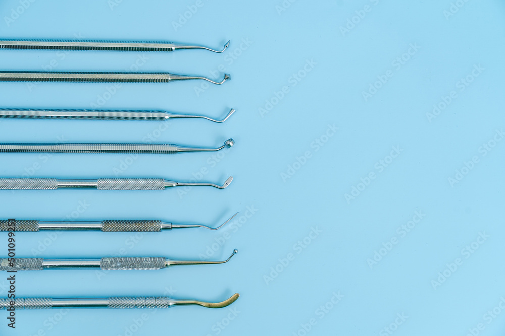 Dentist tool set. Teethcare, dental health concept. Blue background top view copy space Dentist tool set. Teethcare, dental health concept. Blue background top view copy space