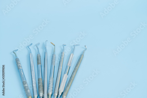 Dentist tool set. Teethcare, dental health concept. Blue background top view copy space