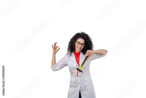 Young brunette woman in white robe holding hammer. Repair concept