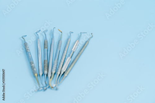 Dentist tool set. Teethcare, dental health concept. Blue background top view copy space