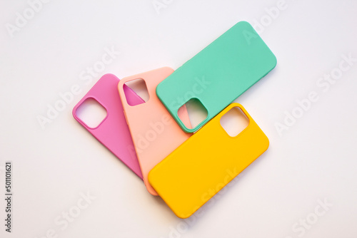 Cases set for smartphone on white background. Silicone protection for mobile phone. Colorful silicone phone cases. photo